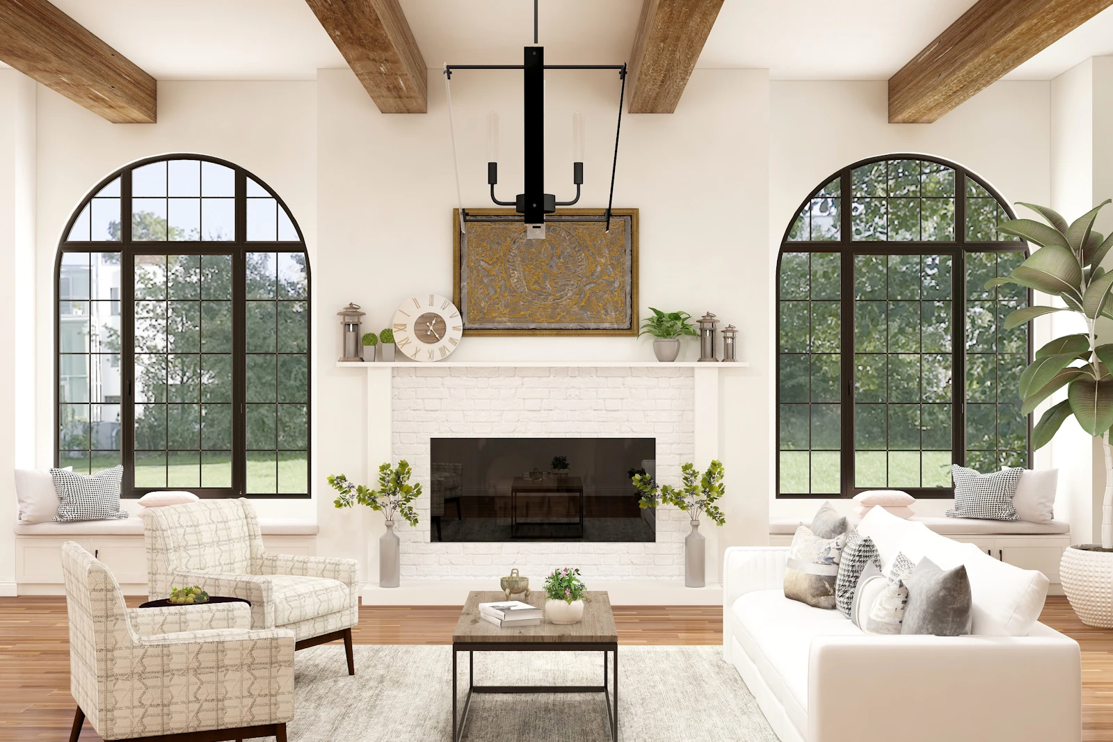 Bright living room with arched windows, a fireplace, a white sofa, and two upholstered chairs, shown as styling inspiration.