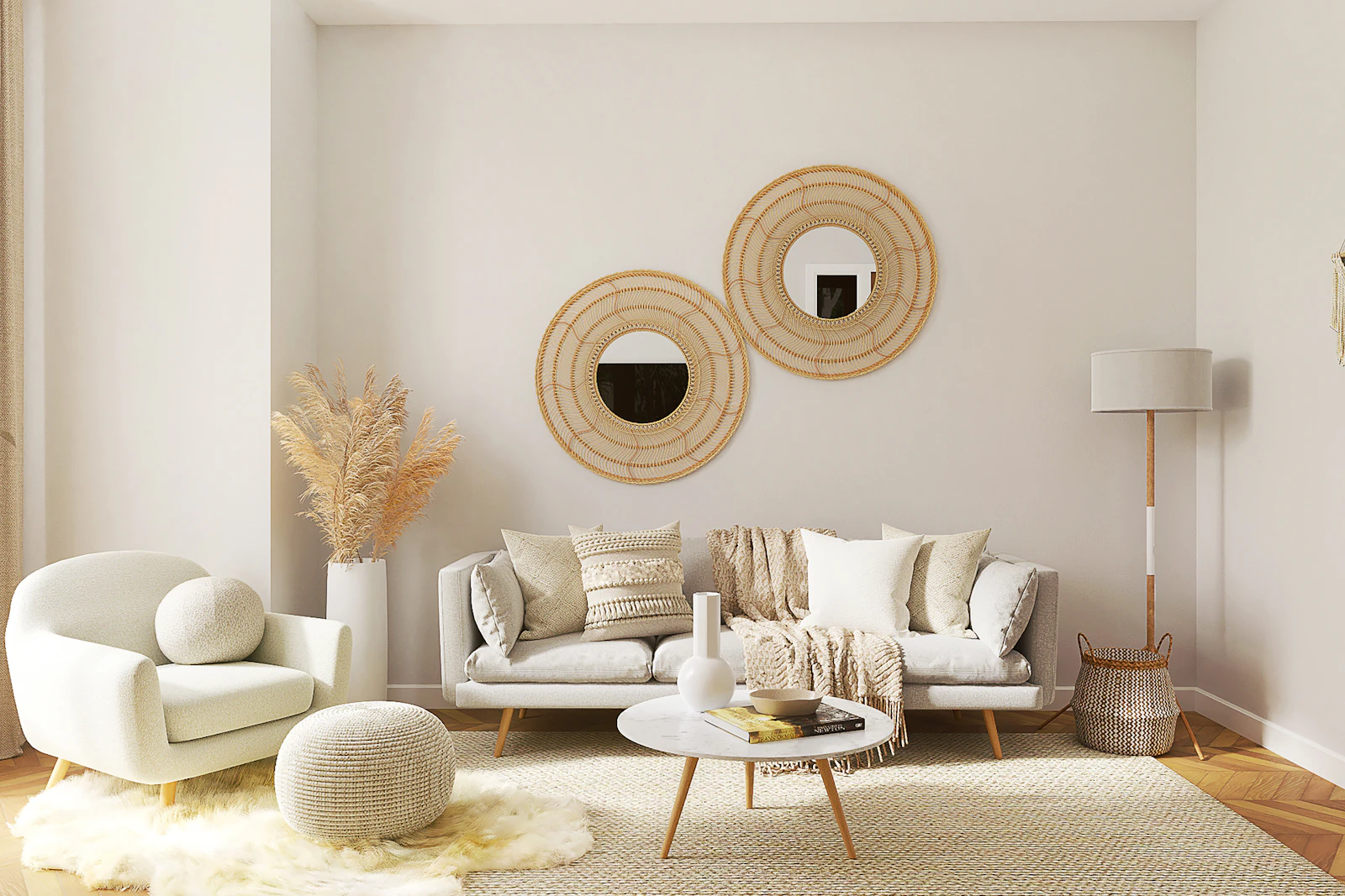 Pale living room with a sofa, lounge chair, round coffee table, woven wall mirrors, and a simple rug, shown as styling inspiration.
